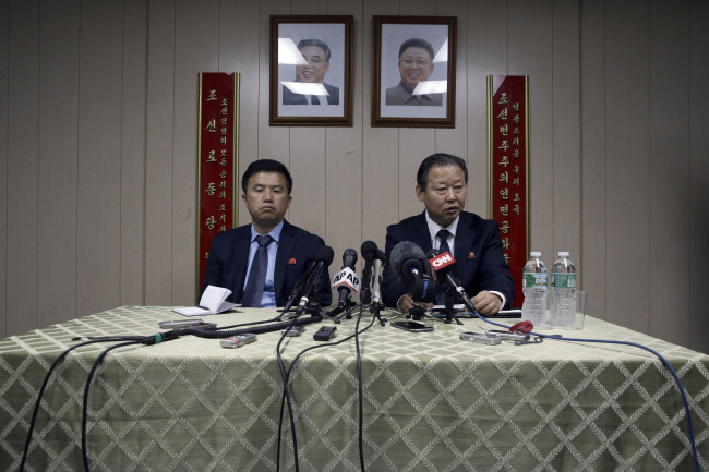 North Korea’s Deputy Ambassador to the U.N. Jang Il-hun (right) is joined by councilor Kwon Jong Gun as he speaks during a news conference on Tuesday at the communist state’s mission in New York. (AP-Yonhap)