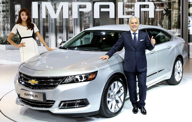 GM Korea CEO Sergio Rocha poses in front of the silver Impala, GM’s full-size sedan at a launch Tuesday. GM Korea 