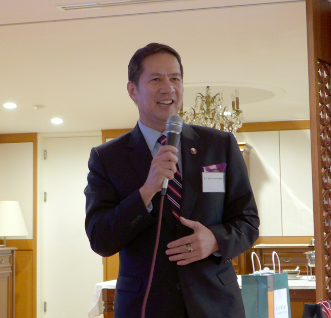 Philippine Ambassador Raul Hernandez sings in front of guests at the Malaysian ambassador's residence on Tuesday. Joel Lee / The Korea Herald