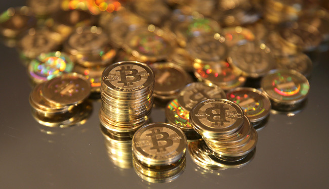 A pile of newly made Bitcoins are arranged for a photograph. Bloomberg