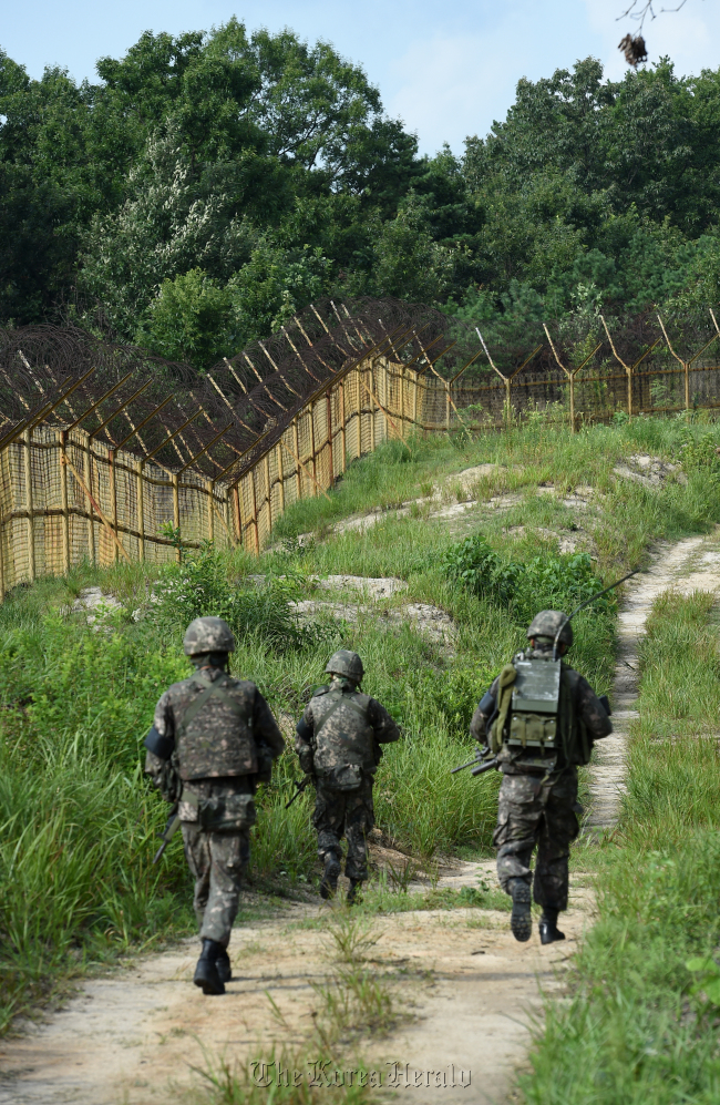 Soldiers patrol the Demilitarized Zone area early this month. (Defense Ministry)