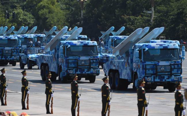 Military vehicles participate in a military parade at Tiananmen Square in Beijing on Thursday to mark the 70th anniversary of victory over Japan and the end of World War II. (AFP-Yonhap)