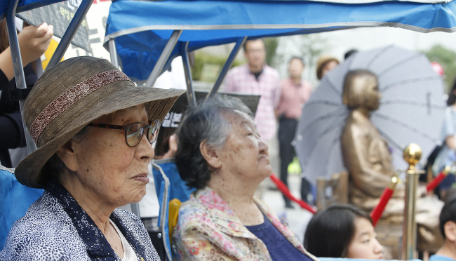 Victims of Japanese wartime sex slavery participate in a rally in front of the Japanese Embassy in Seoul. Yonhap