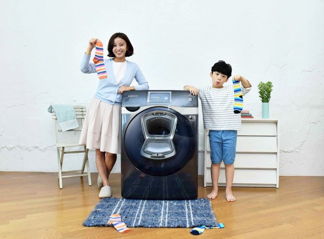 SAMSUNG WASHER GAINS TRACTION -- Sales of tech giant Samsung Electronics’ latest front-load washer model Bubble Shot Add Wash exceeded 6,000 units on Sunday, 15 days after the product launch on Sept. 1. The washing machine features an extra small door which allows users to put additional laundry in the middle of a wash cycle. (Samsung)