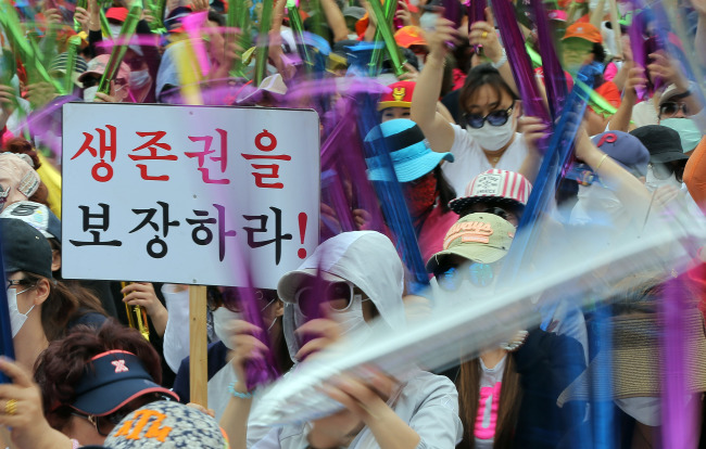 South Korean sex workers participate Wednesday in a rally in central Seoul in protest of the antiprostitution law that has criminalized the sex trade since 2004. Yonhap