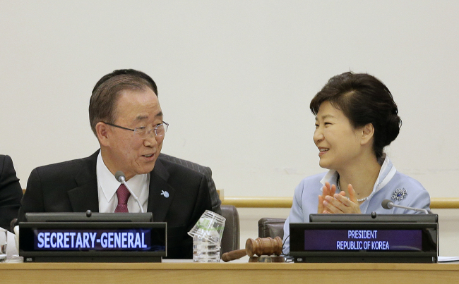 United Nations Secretary General Ban Ki-moon, left, talks with South Korea president Park Geun-hye during a conference on A New Rural Development Paradigm and the Inclusive Sustainable New Communities Model, Saturday, at the United Nations headquarters. (AP)