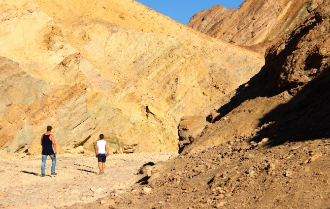 Hikers trudge through rocky passages of Death Valley’s Golden Canyon. (Julie Jackson/The Korea Herald)