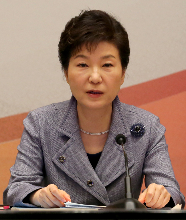 President Park Geun-hye speaks at a meeting with the members of presidential preparation committee for unification held at the Blue House in Seoul on Thursday. (Yonhap)