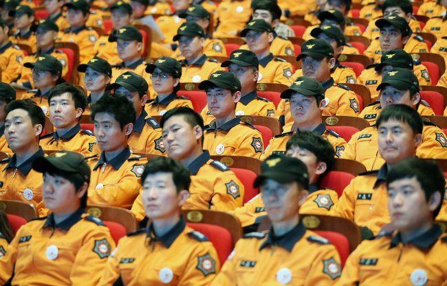 Firefighters in South Korea. Yonhap.