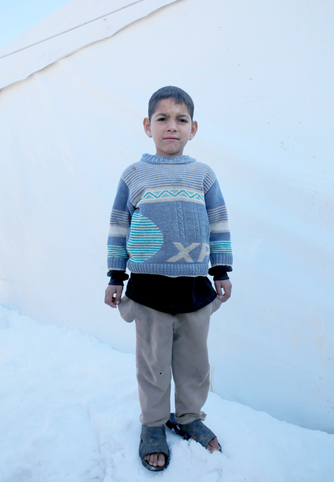 A Syrian child in a refugee camp in Lebanon in January, where ten people died of hypothermia. (Help Syria)