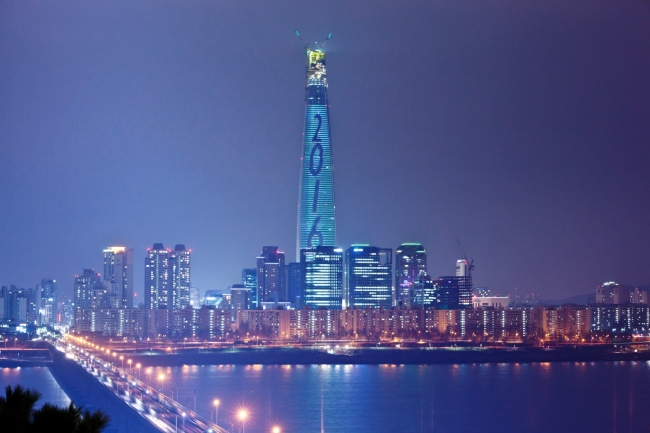 The 123-story Lotte World Tower in Seoul is lit up with LED lights on Tuesday. (Yonhap)