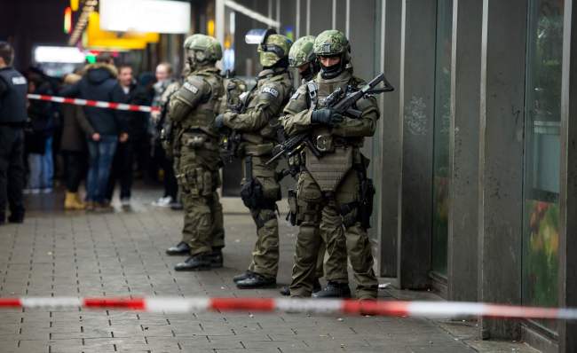 Police is pictured outside the Munich train station on Thursday. German police said Thursday that they had 