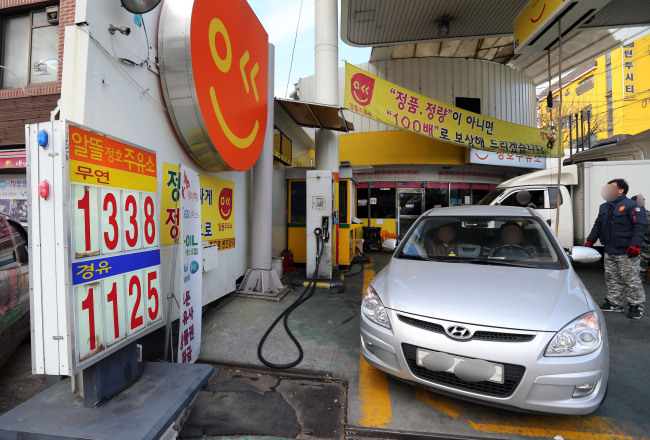 A car pulls out of a gas station in Seoul. Yonhap