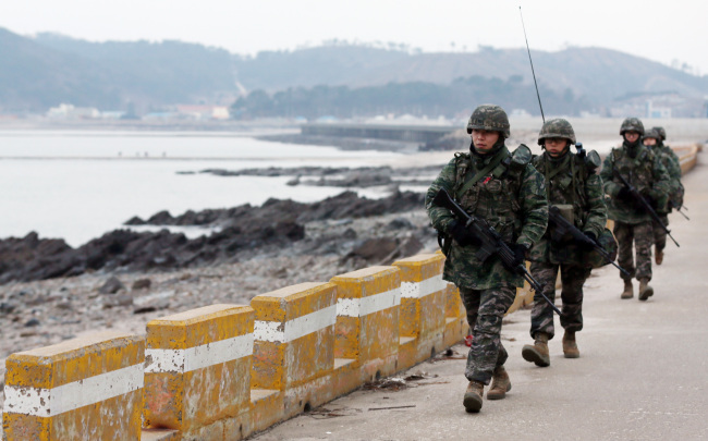 Marines in Gwanghwa island patrol along the cross-border region. Yonhap