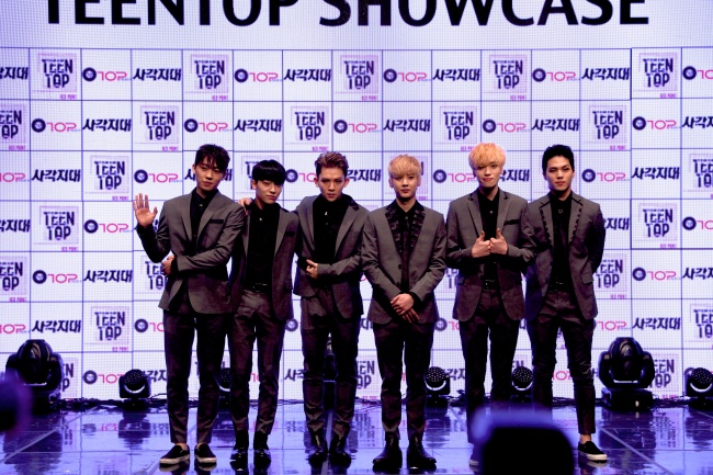 Teen Top members pose for the press at Ilchi Art Hall in Seoul on Monday. (TOP Media)