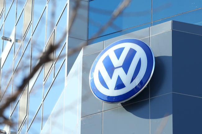 The Volkswagen logo hangs outside a dealership in Seoul. Yonhap