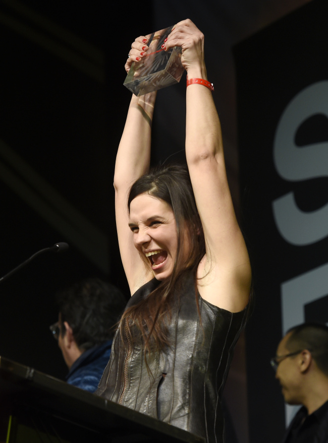 Agnieszka Smoczynska, director of the Polish film “The Lure,” celebrates on the stage after her film won the World Cinema Dramatic Special Jury Award during the 2016 Sundance Film Festival Awards Ceremony on Saturday in Park City, Utah. (AP-Yonhap)