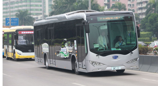 BYD’s electric bus K9 travels on a road in central Beijing. Bloomberg