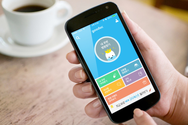 A mobile user uses Goodoc, a mobile app which helps find nearby hospitals and clinics. (Goodoc)