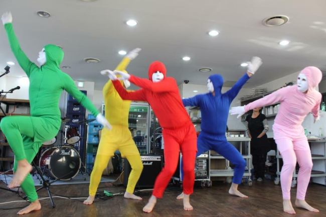 Employees from a South Korean company perform a dance routine at the firm’s year-end party. (The Korea Herald)