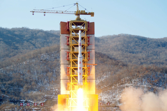 North Korea's long-range rocket carrying the Kwangmyongsong satellite is launched from its Dongchang-ri launch site on Sunday. (Yonhap)