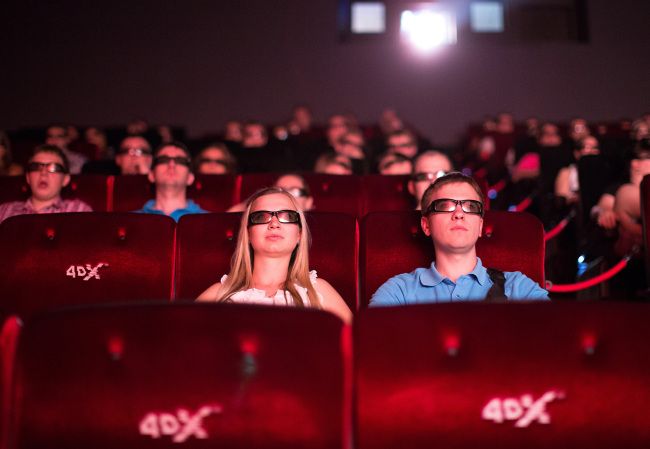 Audience members wear 3-D glasses to watch a movie using 4DX motion picture technology at the Cinema Park multiscreen theatre complex in Moscow, Russia. (Bloomberg)