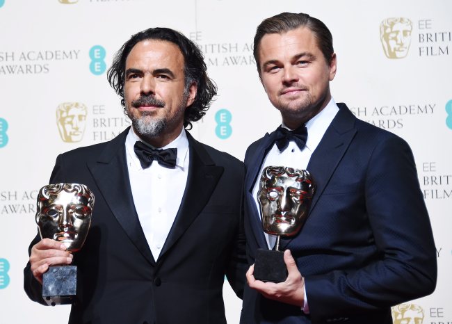 Alejandro Gonzalez Inarritu (left) and Leonardo DiCaprio pose in the press room after winning Best Director and Best Actor, respectively, for “The Revenant” during the 69th annual British Academy Film Awards at the Royal Opera House in London, Britain, Feb. 14. (Yonhap)