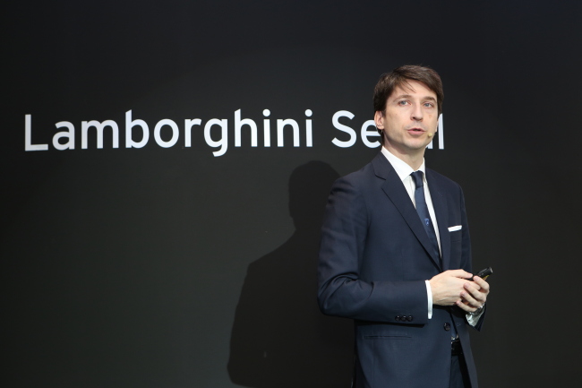 Andrea Baldi, head of the Asia-Pacific region at Lamborghini, makes a presentation of the company and its business before unveiling Huracan LP 580-2 at the launch event in Seoul, Friday. SQDA Motors