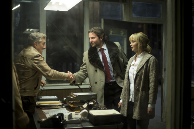 A scene from “Joy,” starring, from left, Jennifer Lawrence, Bradley Cooper and Robert De Niro (20th Century Fox)