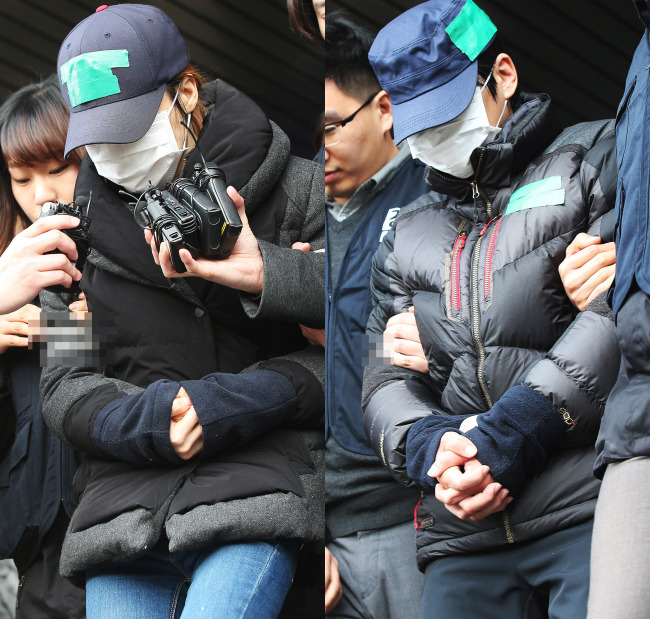 The stepmother (left) of deceased 7-year-old Shin Won-young and father are taken for an on-site survey Monday to a location in Pyeongtaek, Gyeonggi Province, where the body of the boy was found Saturday. (Yonhap)