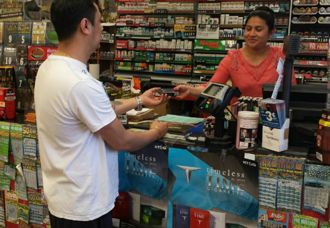 A customer buys a pack of KT&G’s TIME cigarettes at a store in the U.S. (KT&G)