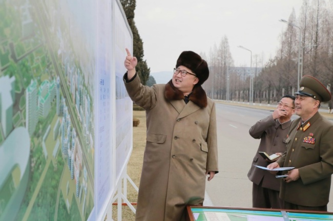 Picture released from North Korea`s official Korean Central News Agency shows North Korean leader Kim Jong-Un guiding the construction of Ryomyong Street in Pyongyang. AFP-Yonhap