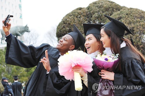 Graduates of Konkuk University in Seoul attend a graduation ceremony on Feb. 22. (Yonhap)
