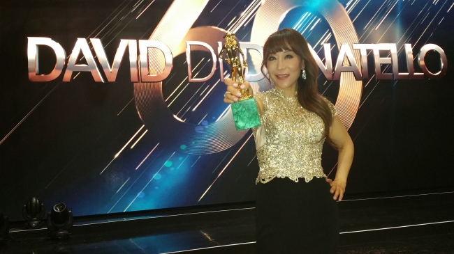 Soprano Sumi Jo holds the award for Best Original Song at the David Di Donatello Awards at Rome’s Tiburtina Studios Monday. (PRM)