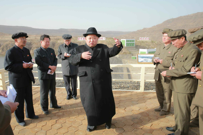 North Korean leader Kim Jong-un inspects a newly built hydropower station near Mount Paektu inPaekam, Yangang Province bordering China. (Yonhap)