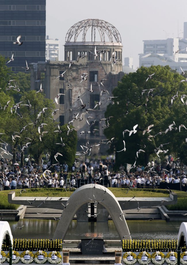 Doves fly up over the atomic bomb dome during the peace memorial ceremony marking the 70th anniversary of the atomic bombing at Hiroshima Peace Memorial Park in Hiroshima, Japan. (EPA-Yonhap)