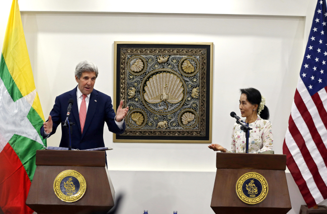 John Kerry (left) and Aung San Suu Kyi (AP)