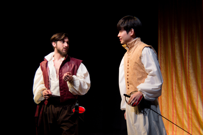 Young lover Claudio (Charles Jeong, right) speaks with Prince Don Pedro (S. Vollie Osborne) in Seoul Shakespeare Company’s production of “Much Ado About Nothing,” playing at Theater Egg and Nucleus in Hyehwa, Seoul, until June 5. (Laura Jasi)
