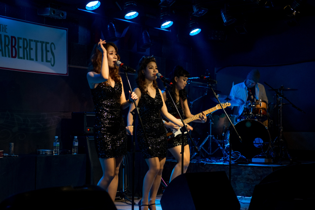 The Barberettes perform on stage during the group’s nationwide tour earlier this year. (EggPlant)