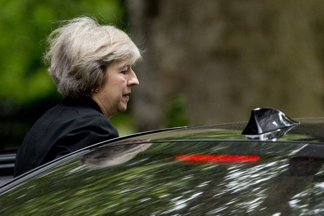 British Home Secretary and leadership candidate for Britain's ruling Conservative Party Theresa May gets in a car as she leaves after attending a cabinet meeting at 10 Downing Street, in London, Tuesday, July 5, 2016. British Prime Minister David Cameron resigned on June 24 after Britain voted to leave the European Union in a referendum. (AP Photo)