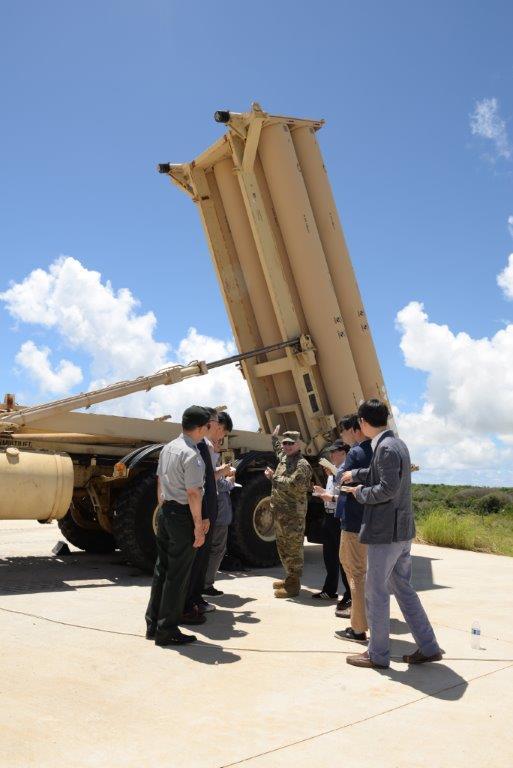 Reporters take a look at a THAAD battery during a tour to the Anderson Air Force Base in Guam on Monday. (The U.S. Air Force's 36th Wing)