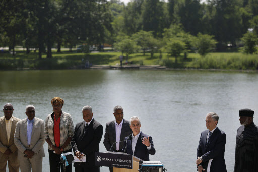 Chicago Mayor Rahm Emanuel (third from right) speaks about the future of the Obama Presidential Center as Marty Nesbitt (fourth from right), chair of the Obama Foundation, listens during a news conference and Jackson Park is seen in the background Wednesday in Chicago, Illinois. (AFP-Yonhap)