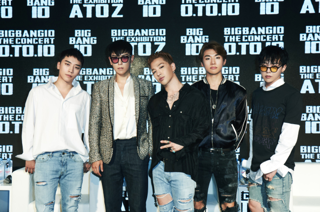 Members of Big Bang -- (from left) Seungri, T.O.P, Taeyang, Daesung and G-Dragon -- pose for a photo at a press conference Thursday in Seoul. (YG Entertainment)