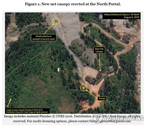 This satellite imagery dated Aug. 4, 2016, shows continuing activities at the site of North Korea`s fourth nuclear test, including the setting up of a large net and what appear to be small vehicles or carts near the area, while supplies and equipment spotted in imagery from July are no longer there. (Yonhap)