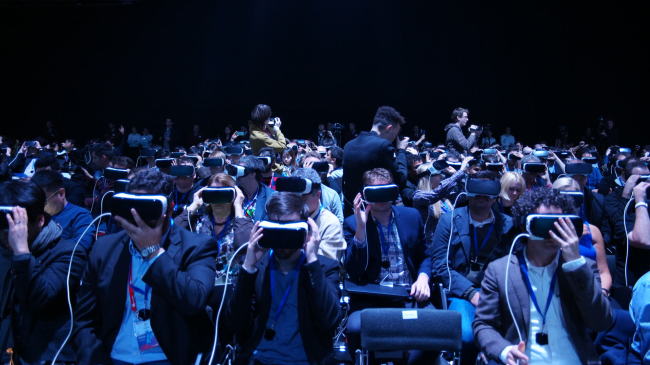 Journalists wear Samsung Electronics' Galaxy VR headset at the Galaxy S7 launch event held in February in Barcelona.