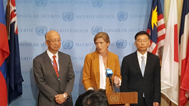 US Ambassador Samantha Power (center) speaks to the press next to South Korean Ambassador Hahn Choong-hee (right) and Japanese Ambassador Koro Bessho, following the United Nations Security Council’s closed-door meeting to discuss the latest missile launches by North Korea at the United Nations in Manhattan, New York, Tuesday. (Yonhap)