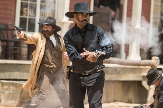 Denzel Washington (center) plays Chisolm in the movie “The Magnificent Seven” directed by Antoine Fuqua. (Columbia Pictures/TNS)