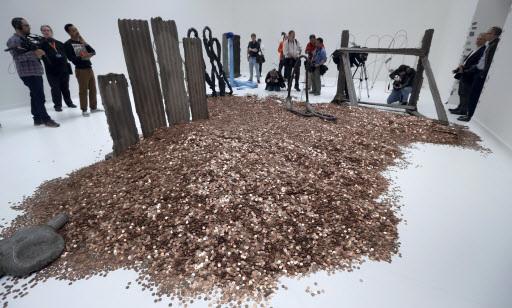 Media gather around part of an artwork by Michael Dean, one of the four artists shortlisted for the Turner Prize 2016, as it is displayed at the Tate Britain gallery in London, Monday. (AP-Yonhap)