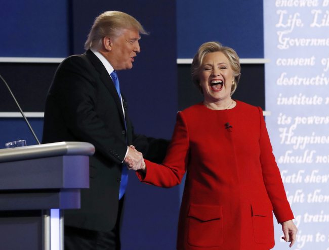 US Republican presidential nominee Donald Trump greets Democratic presidential nominee Hillary Clinton after their first presidential debate at Hofstra University in Hempstead, New York, Tuesday. (Reuters-Yonhap)