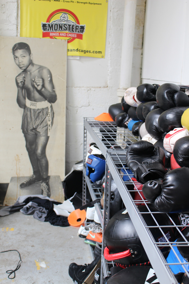 Boxing gloves and other pugilistic gear at Louisville TKO Boxing await young people who, like the pictured 12-year-old Cassius Clay, dream of someday being the greatest -- or at least pretty good. (Alan Solomon/Chicago Tribune/TNS)